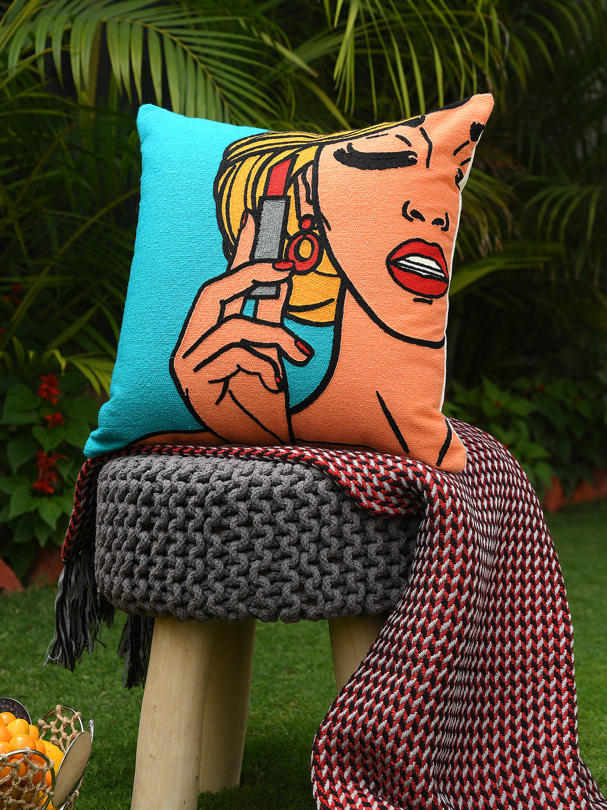 Retro vintage pop art girl holding a lipstick cushion cover