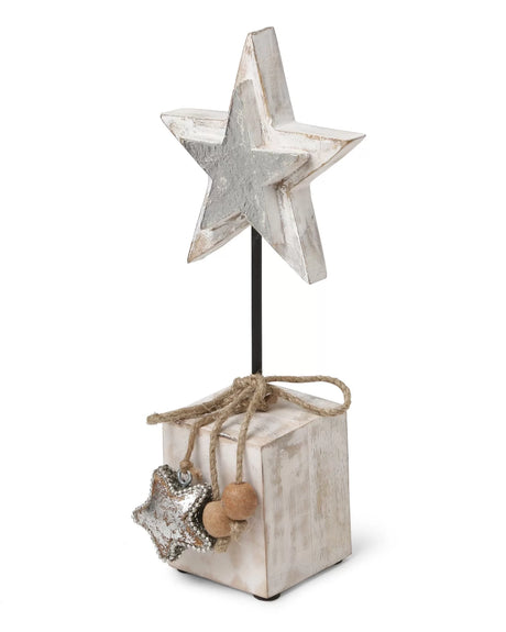 White wooden star table decor with silver foil detailing on iron stand