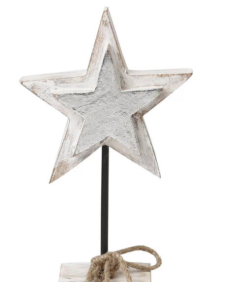 White wooden star table decor with silver foil detailing on iron stand.