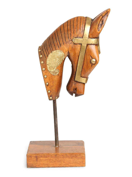 Handcrafted horse head table décor in natural wood with gold detailing.