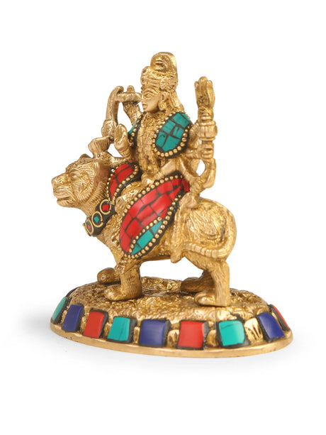 Handcrafted brass statue of Durga Ma with colorful stone accents.