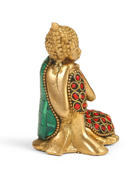 Buddha brass statue with colorful turquoise, red, and blue detailing, handcrafted to showcase peace and tranquility.
