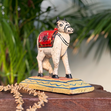 Decorative wooden Nandi in vintage style for home or office adornment.