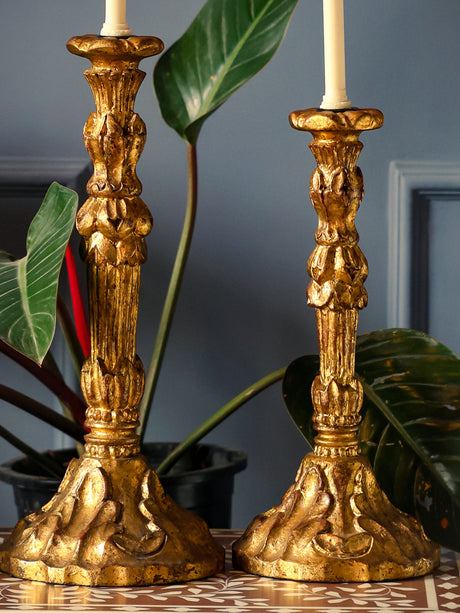 Gold foil Antique candle holders with intricate design and handcrafted wood base.