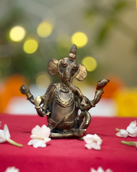 Antique brass Lord Ganesha Dhokra art idol made using lost wax technique.