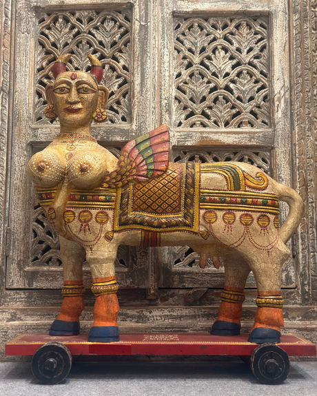 Kamdhenu with wings on wheels