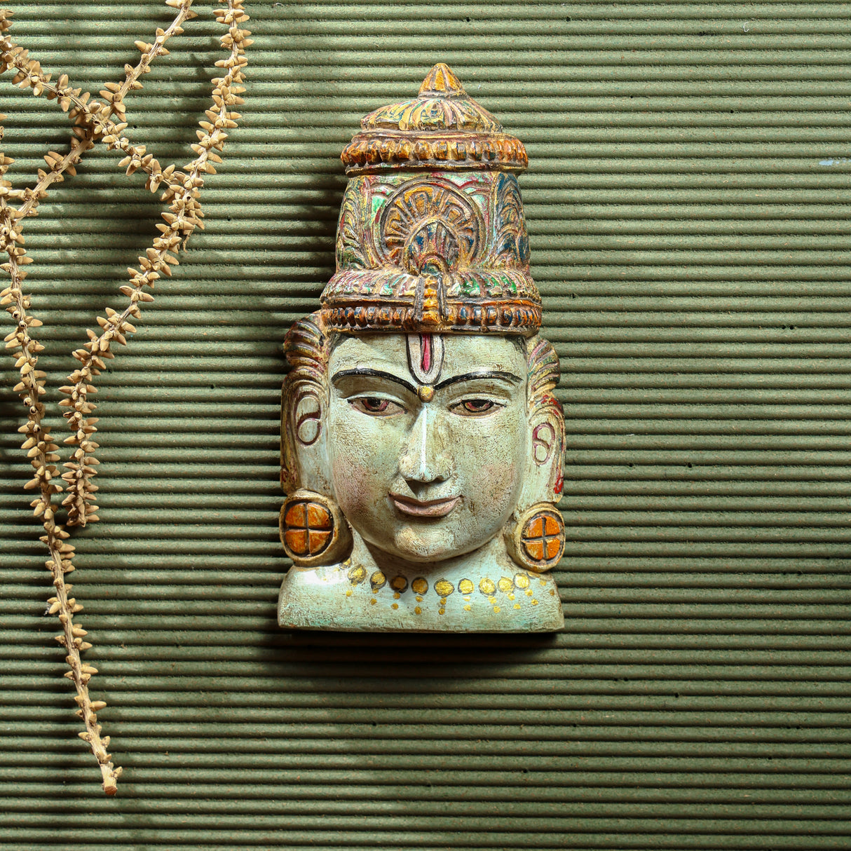 Hand-painted Vishnu mask in assorted colors, crafted from Vaaghai wood, showcasing Lord Vishnu’s serene and powerful expression.