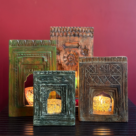 Antique-inspired rustic green Jharokha frames, handcrafted with intricate patterns and glowing candles, perfect for enhancing any space.