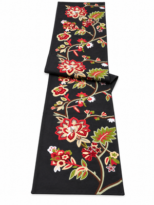 Embroidered black runner with flower pattern