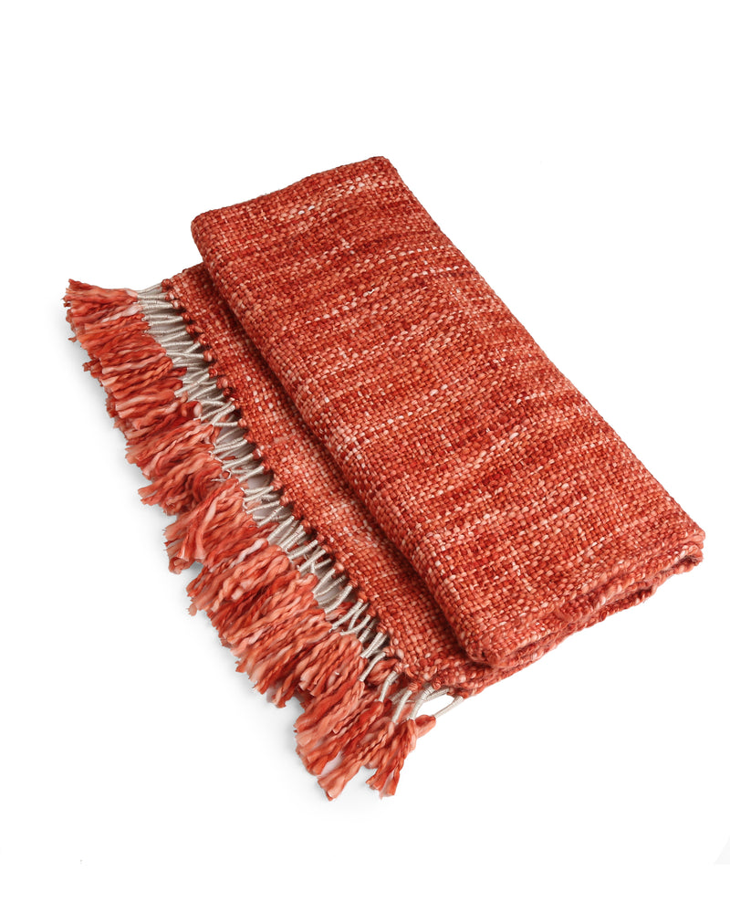 Soft Chunky Acrylic Wool throw in hues of rust and ivory weaving