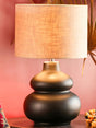 Elegant black ceramic table lamp with soft beige shade enhancing modern home decor