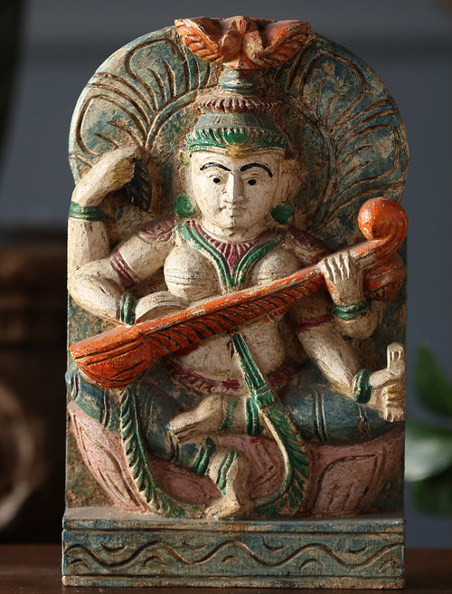 Wooden Whisper - Saraswati Carved Sculpture