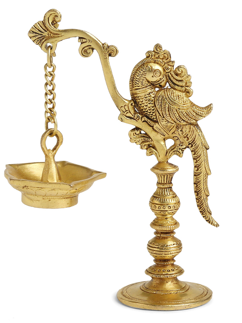 Brass peacock lamp with hanging Diya