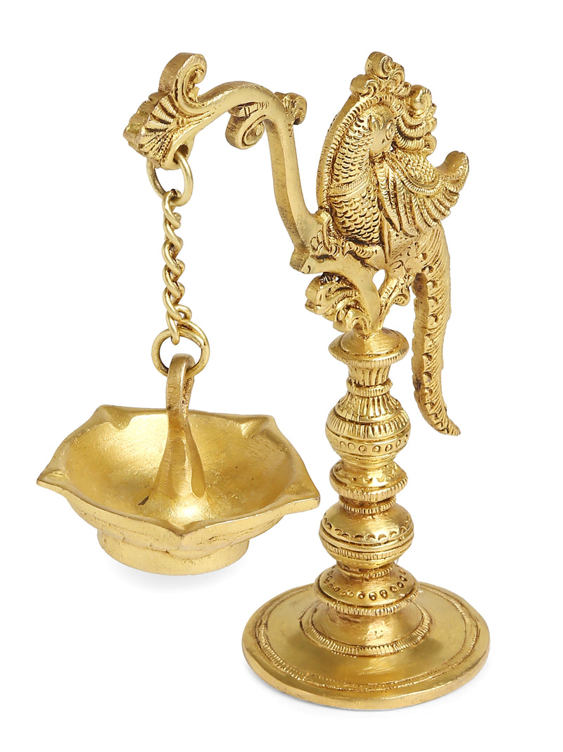 Brass peacock lamp with hanging Diya