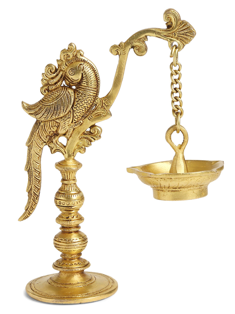 Brass peacock lamp with hanging Diya