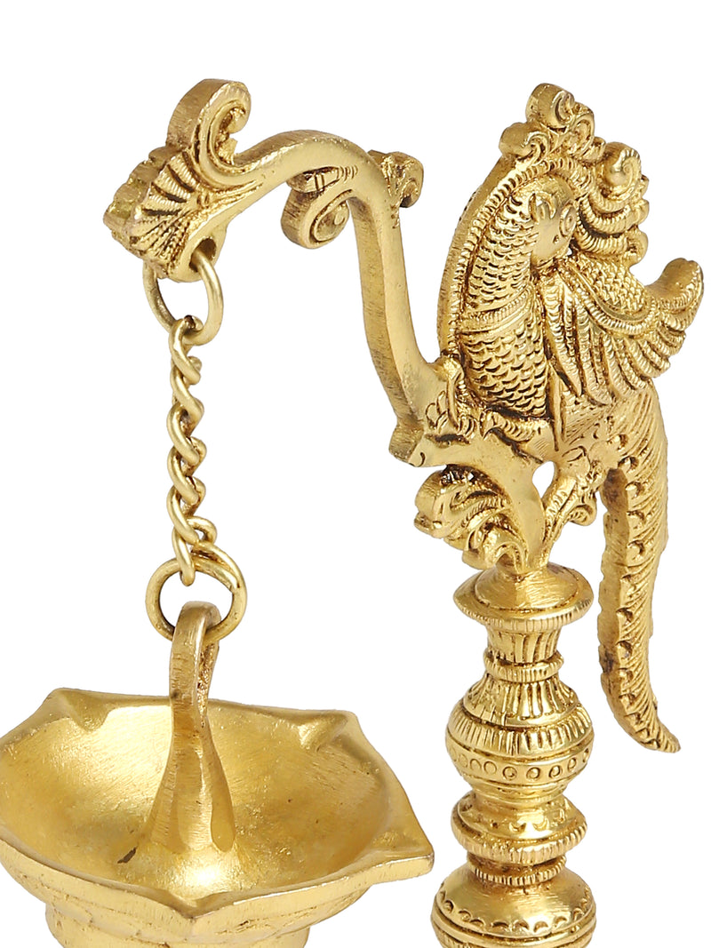 Brass peacock lamp with hanging Diya