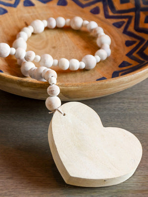 Minimal white wooden beaded garland for tabletop home decor.